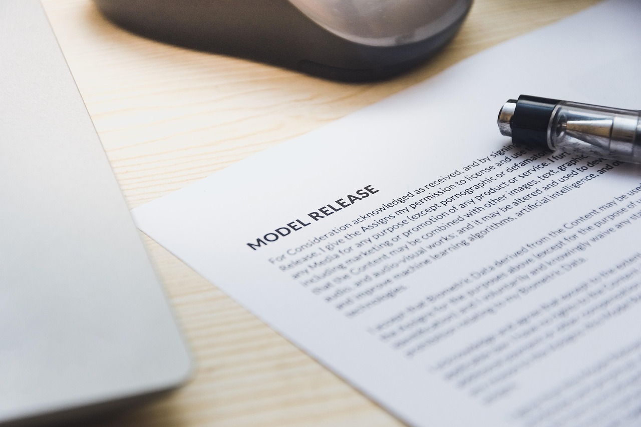 Signing document desk pen - Funeral Policy vs Burial Society