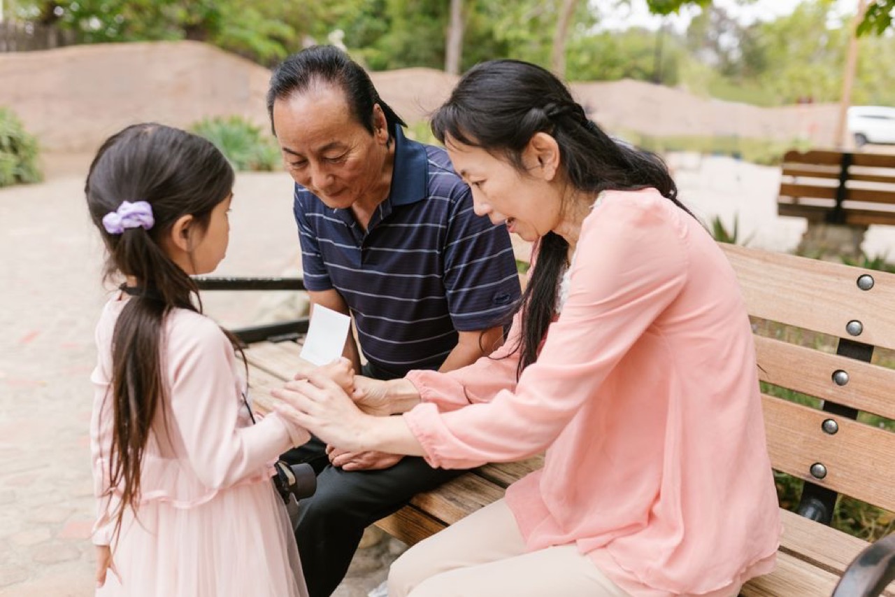 Hands holding paper family - Shoprite Funeral Cover