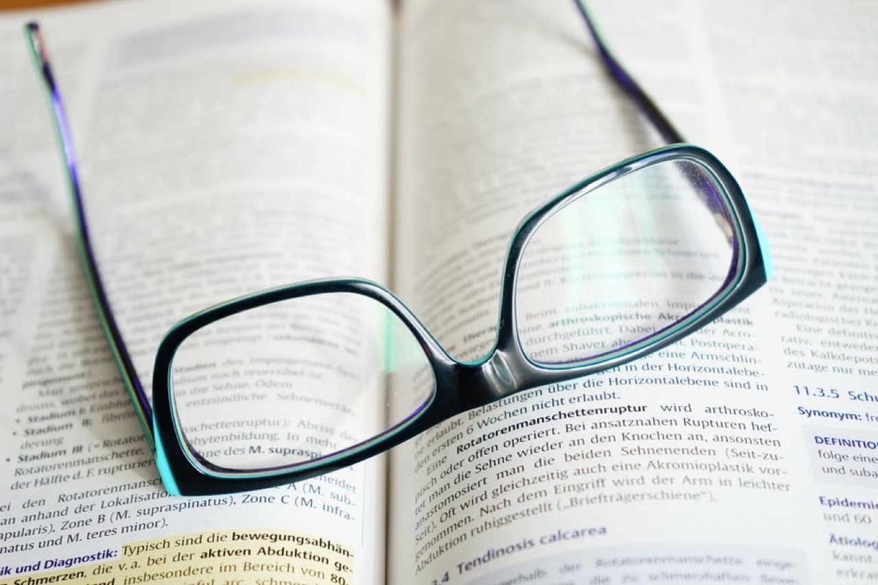 Bible verses for funerals Book and reading glasses - Bible verses for funerals