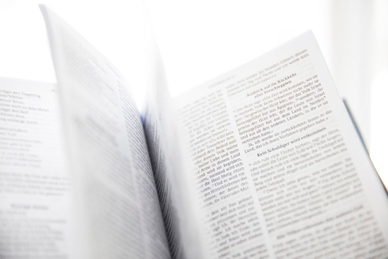 Funeral Blues - meaning and when to read it Bible open soft light - Funeral Blues - meaning and when to read it
